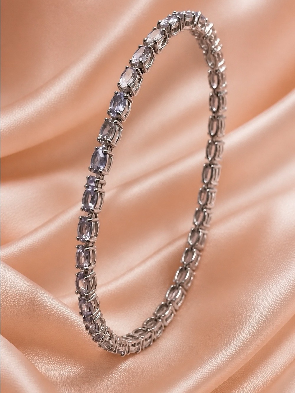 Tanzanite tennis bracelet set in rhodium over 925 Sterling Silver. Brand new!
